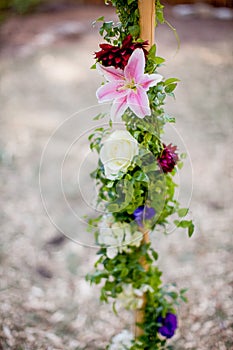 Flowers wrapped around a pole