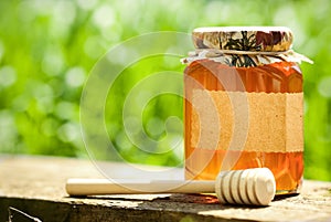 Flowery honey in glass jar