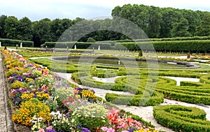Flowery park, planted with trees, with water tanks of Bruhl castle in Germany