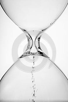 Flowing hourglass in white background
