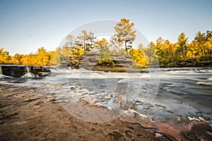 Flowing Kettle River in Banning State Park in Minnesota during the fall. Long exposure