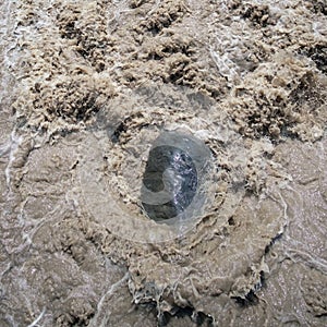 Flowing muddied water