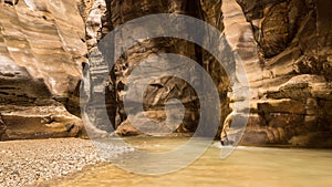 Flowing river in canyon of Wadi Mujib, Jordan photo