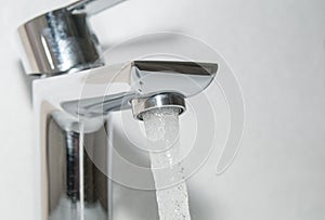 Flowing water from bath faucet