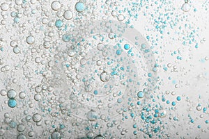 Flowing water, blue and grey bubbles