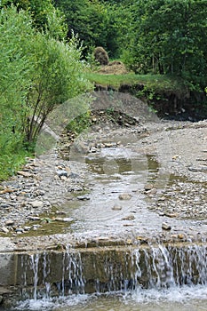 Flowing water in mountain stream. Carpathians