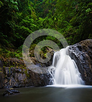 Flowing waterfall at Crystal Cascades in Cairns, Australia