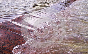 Flowing water in the fountain. decorative, natural.