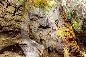 Flowstone (Petrification waterfalls, draperies) in Prometheus Cave Natural Monument, Georgia photo