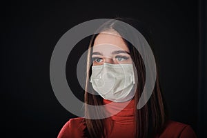 Flu cold or allergy symptom. Sick young woman sneezing in mask isolate on black background. Health care. Studio shot. Business