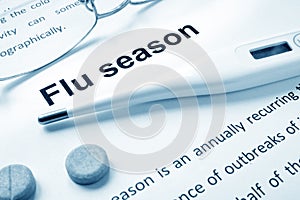 Flu season sign on a paper.