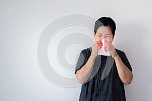 Flu senior Asian woman and using tissue paper,Elderly female sneezing,Copy space for text on white background