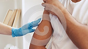 Flu shot vaccine inoculation jab patient shoulder