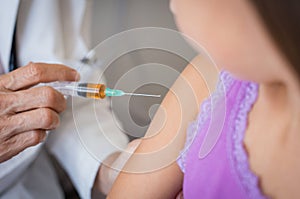 Flu vaccine to little girl