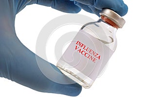 Flu vaccine vial concept held by latex gloved hand on white background