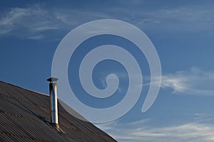 Flue chimney to the roof of the house.