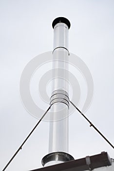 Flue pipe - a tall chimney from wood burning stove - Fossil fuels