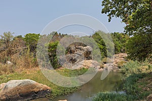 fluent river with rocks and vegetation in Africa. Lubango. Angola.