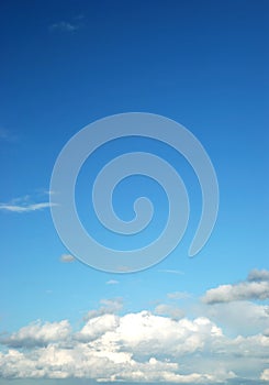 Fluffy cloud on bright blue sky