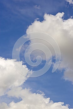 Fluffy clouds on blue sky background