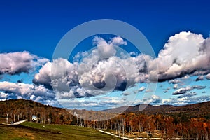 Fluffy Clouds over Autumn Colors photo