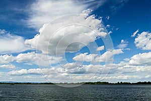 Fluffy clouds over river Danube in Bratislava, Slovakia