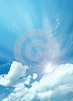 Fluffy clouds with sun on the sky, soft focus. Heavenly clouds background in summer day. Concept of freedom, relaxation, ecology.