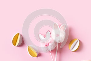 Fluffy easter decoration rabbit, easter creative concept on pink background