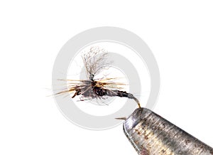 Fluffy fly fishing hook on white background