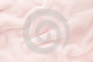 Fluffy Gentle baby pastel pink rose fabric with waves and folds. Soft pastel textile texture