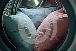 Fluffy pillows spinning in washing machine for deep clean