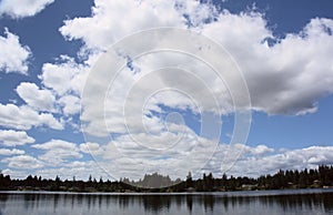 Fluffy Stratocumulus Clouds Over The Lake photo