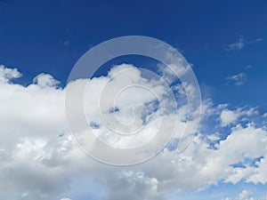 Fluffy white clouds and blue sky