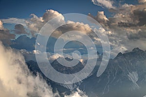 Fluffy white clouds over Sexten Dolomites peaks Sudtirol Italy