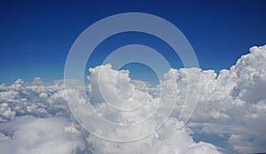 The fluffy white of the cumulus cloud with a blue sky background.