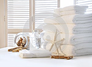 Fluffy white towels on table