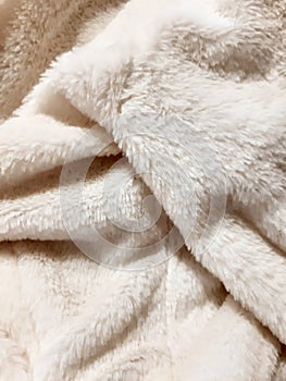 Fluffy winter faux fur texture, closeup. Warm, cozy, soft, fluffy. Background design, photography. Textile, fabric template,