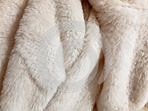 Fluffy winter faux fur texture, closeup. Warm, cozy, soft, fluffy. Background design, photography. Textile, fabric template,