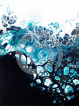 Fluid abstract acrylic paintings, mixing blue, black, white color