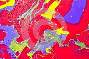 Fluid Art. Abstract wavy background or texture. Red, violet and yellow color mixing with golden spray