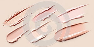 Fluid cosmetics textures featuring spread highlighter and foundation cream