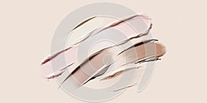 Fluid cosmetics textures featuring spread highlighter and foundation cream