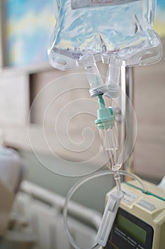 The fluid intravenous drip saline dropping for the admit patient in the room at hospital