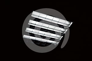 Fluorescent lamp on the black background