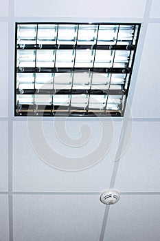 Fluorescent lamp on the modern office ceiling