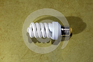 fluorescent light bulb, on a green background