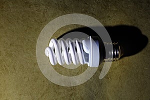 fluorescent light bulb, on a green background