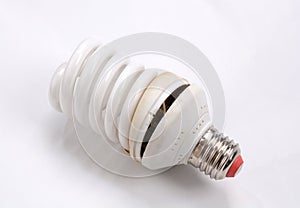 Fluorescent Lightbulbs. One compact old fluorescent light bulb over on white background