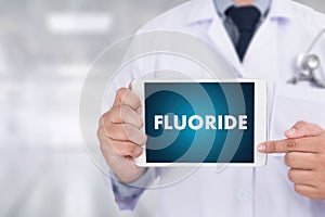 FLUORIDE Medicine doctor hand working Professional doctor use co