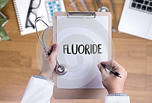 FLUORIDE Medicine doctor hand working Professional doctor use co